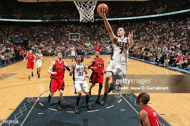 Bostjan Nachbar of the New Jersey Nets drives to the basket for a layup against the Toronto Raptors in Game Six of the Eastern Conference...