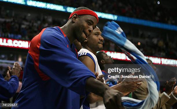 Chris Webber of the Detroit Pistons celebrates from the bench in the final minutes of their 81-74 win against the Chicago Bulls in Game Three of the...