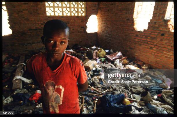 Local child stands amid the debris September 16, 1994 at a church in Ntarama, Rwanda. The bodies of four hundred Tutsis murdered by Hutu militiamen...