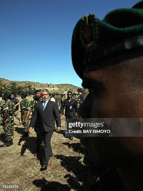 East Timorese acting President Xanana Gusmao inspects troops during a ceremony in Dili, 11 May 2007 as the country is expecting the official results...