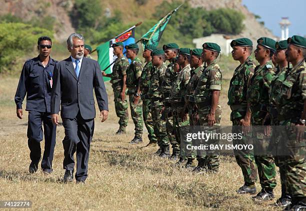East Timorese acting President Xanana Gusmao inspects troops during a ceremony in Dili, 11 May 2007 as the country is expecting the official results...