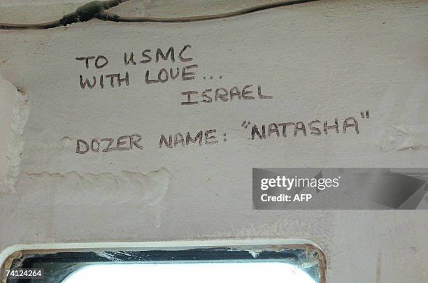 Picture taken 10 May 2007 in the US base Camp Speicher near Tikrit in Iraq shows a graffiti left by Israeli soldiers to USMC above the steering wheel...
