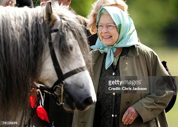 Queen Elizabeth II pats her horse Balmoral Melody as she attends the Royal windsor Horseshow on May 11, 2007 in Windsor, England. This is the second...