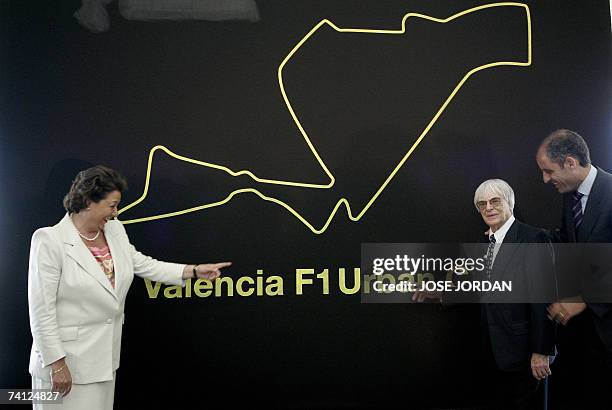 Mayor of Valencia Rita Barbera, Formula 1 President Bernie Ecclestone and Regional President Francisco Camps pose by a map of a proposed circuit...