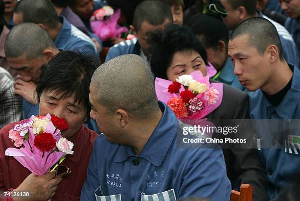 Inmates reunite with their mothers during a ceremony held at the Tiebei Prison to celebrate Mother's Day May 11, 2007 in Changchun of Jilin Province,...