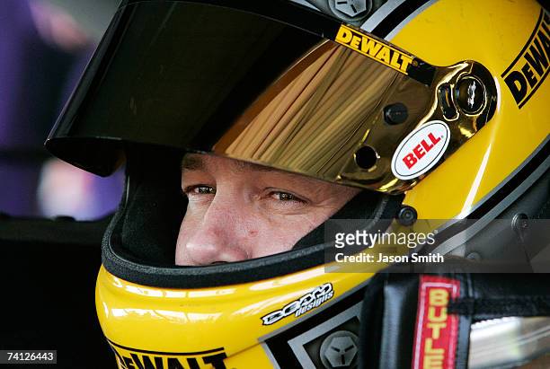 Matt Kenseth, driver of the DeWalt Ford, sits in his car during practice for the NASCAR Nextel Cup Series Dodge Avenger 500 on May 11, 2007 at...