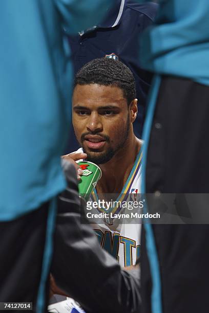 Tyson Chandler of the New Orleans/Oklahoma City Hornets looks on from the bench area during the NBA game against the Utah Jazz at Ford Center on...