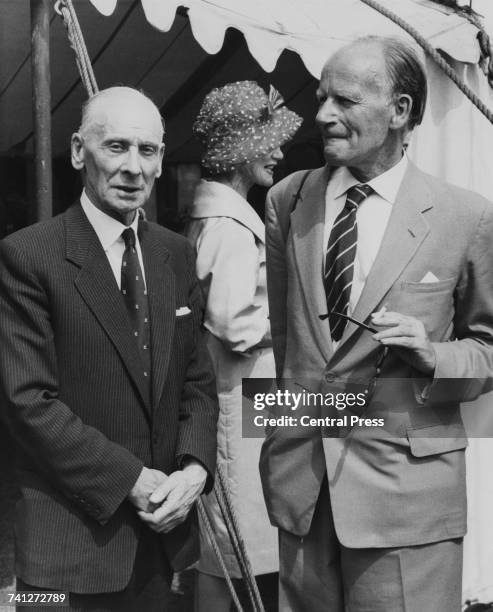 English cricketer Sir Jack Hobbs and writer Stephen Potter watching a cricket match between the National Book League and Authors teams, Vincent...