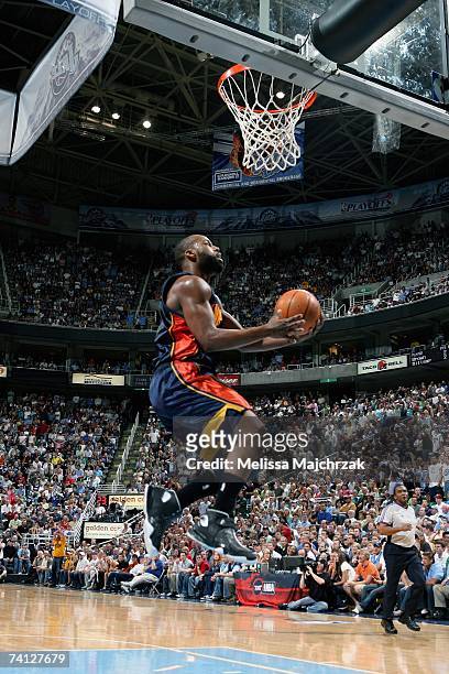 Baron Davis of the Golden State Warriors goes in for a basket in Game One of the Western Conference Semifinals against the Utah Jazz during the 2007...