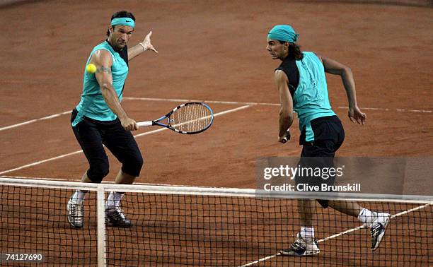 Rafael Nadal and Carlos Moya of Spain in action against Bob Bryan and Mike Bryan of the USA in their quarter final match during the ATP Masters...