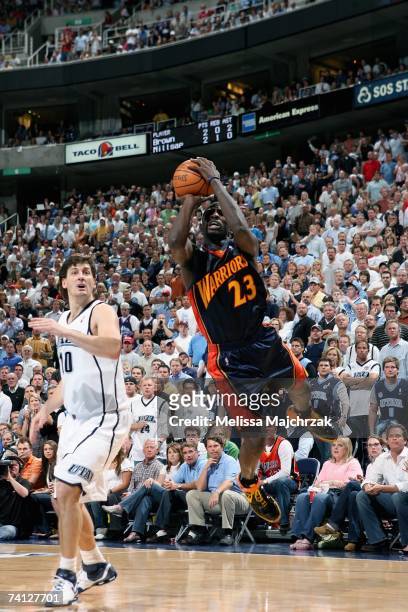 Jason Richardson of the Golden State Warriors goes up for a shot past Gordan Giricek of the Utah Jazz in Game One of the Western Conference...