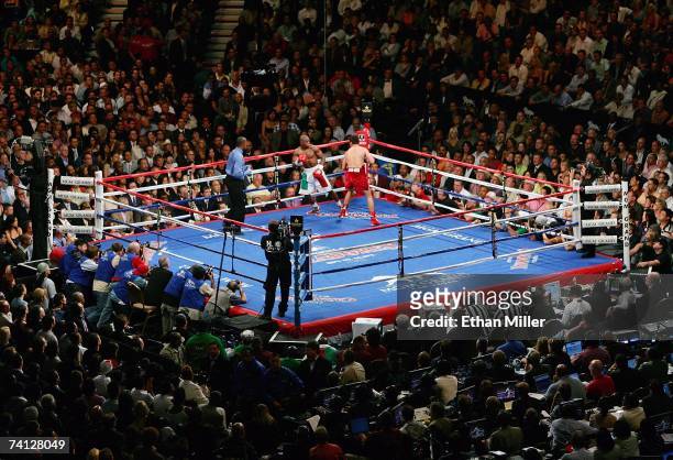 Floyd Mayweather Jr. And Oscar De La Hoya fight during their WBC super welterweight championship bout at the MGM Grand Garden Arena May 5, 2007 in...