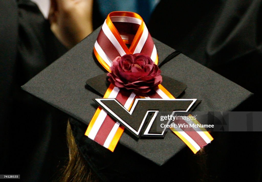 A Virginia Tech graduate student displays a memorial ribbon on the