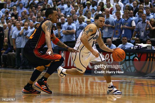 Deron Williams of the Utah Jazz drives to the basket against Matt Barnes of the Golden State Warriors in Game Two of the Western Conference...