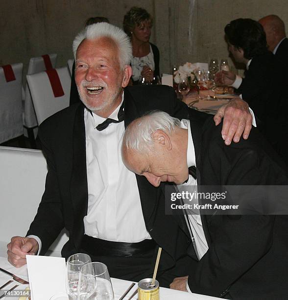 Photographer Robert Lebeck shares a laugh with photographer Thomas Hoepker at the Henri Nannen Award at the Schauspielhaus on May 11, 2007 in...