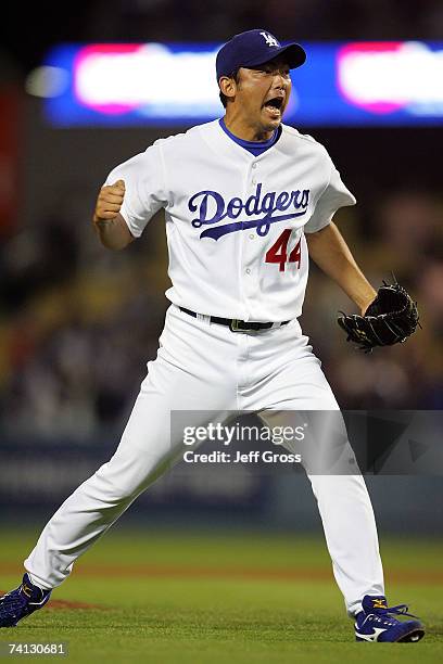 Pitcher Takashi Saito of the Los Angeles Dodgers celebrates after saving the game for a 2-0 win against the Cincinnati Reds at Dodger Stadium on May...