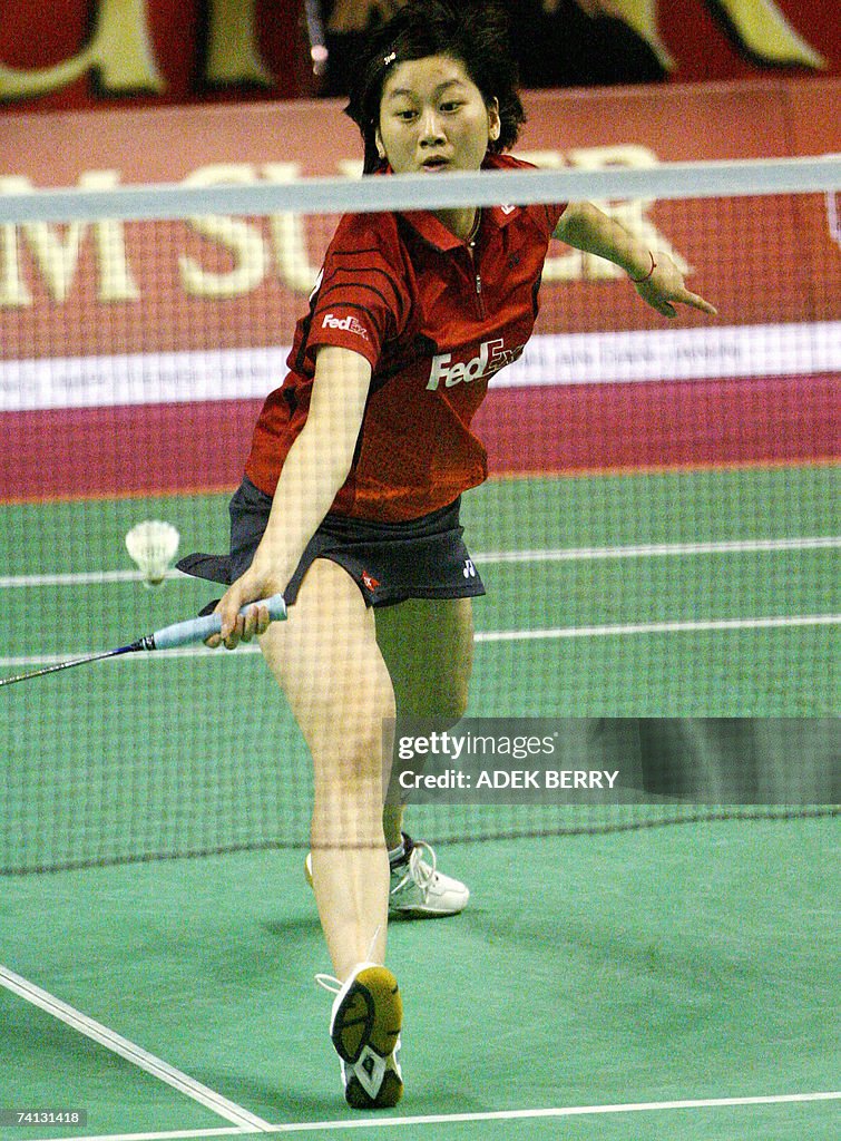 Pi Hongyan Chinese badminton player Zhu Lin returns the shuttle cock to her ...