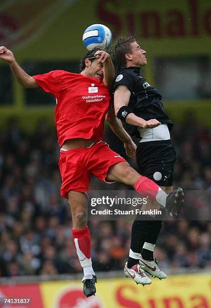 Marvin Braun of St. Pauli is challenged by David Krecidlo of Dusseldorf during the Third League Northern Division match between FC St.Pauli and...
