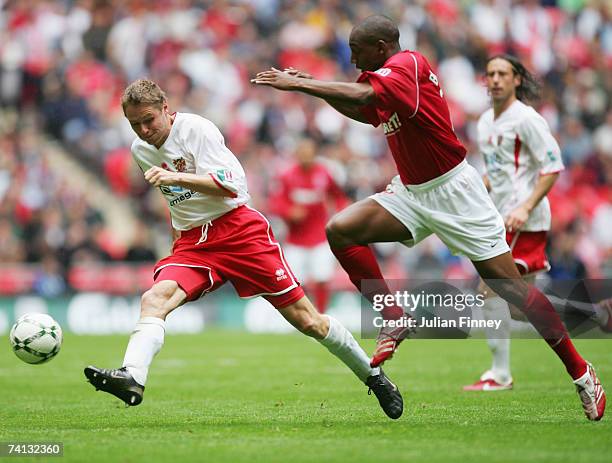 Steve Guppy of Stevenage Borough takes on Michael Blackwood of Kidderminster Harriers during the FA Trophy Final match between Kidderminster Harriers...