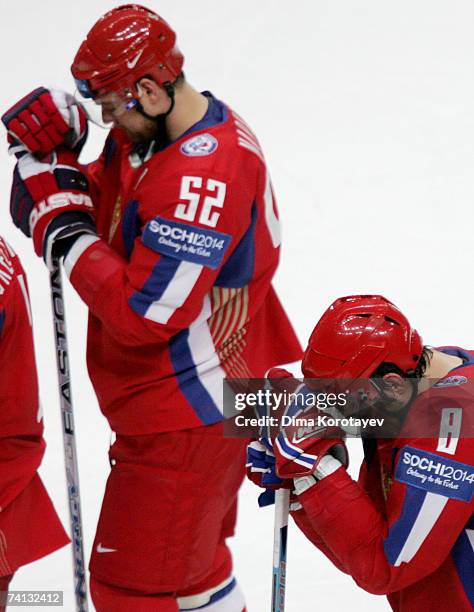 Russia's Alexander Ovechkin and Andrey Markov react after losing the IIHF World Ice Hockey Championship semi-final match between Russia and Finland...