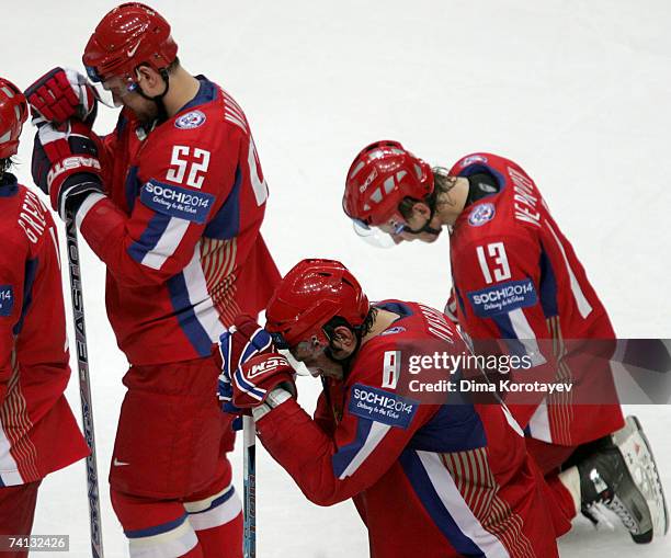 Russia's Alexander Ovechkin , Andrey Markov and Ivan Nepryaev react after losing the IIHF World Ice Hockey Championship semi-final match between...