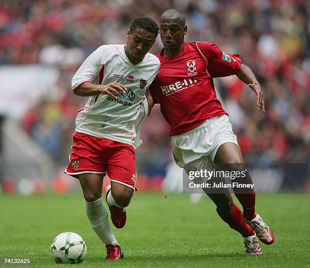 Craig Dobson of Stevenage Borough holds off Michael Blackwood of Kidderminster Harriers during the FA Trophy Final match between Kidderminster...