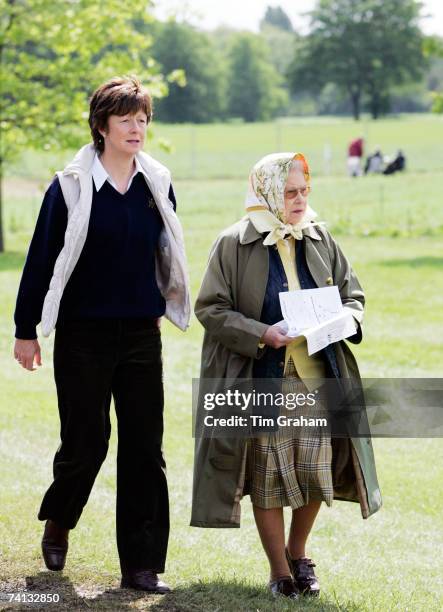 Queen Elizabeth II accompanied by her bodyguard Carol Quirk attends the third day of Royal Windsor Horse Show on May 12, 2007 in Berkshire, England.