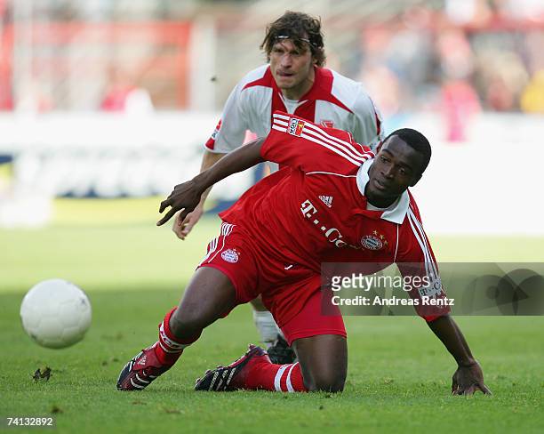 Louis Ngwat Mahop of Munich vies for the ball with Steffen Baumgart of Cottbus during the Bundesliga match between Energie Cottbus and Bayern Munich...