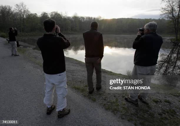 Team from Nikon Optics searches a pond at sunrise for birds during the World Series of Birding, 12 May 2007, in High Point State Park, New Jersey....