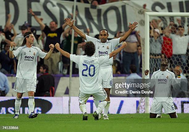Gonzalo Higuain, Emerson Sergio Ramos and Mahamadou Diarra of Real Madrid celebrate after they beat Espanyol 4-3 during the Primera Liga match...