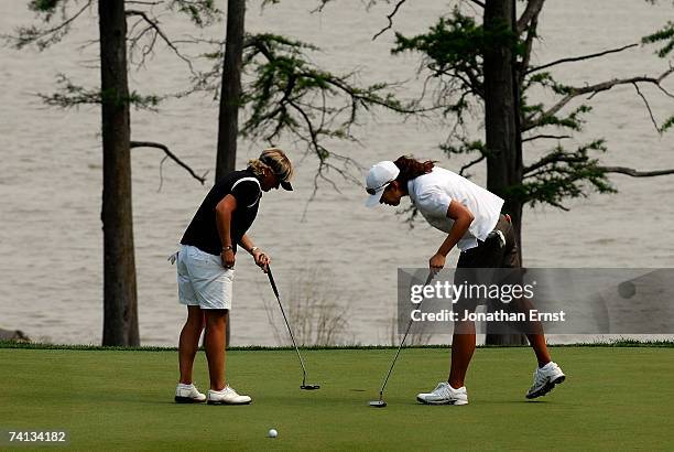 Sarah Lee of South Korea and Becky Morgan of Wales play on the 16th green in Round 3 of the LPGA Michelob ULTRA Open at Kingsmill on May 12 in...