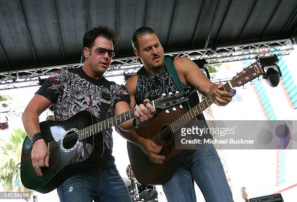 Musicians Chris "Abby" Abbondanza and Chris Higbee of the band "PovertyNeck Hillbillies" perform onstage during day one of the Academy of Country...