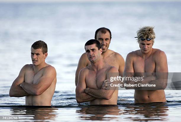 Brett Voss, Shane Birss, Fraser Gehrig and Nick Riewoldt of the Saints participate in the St Kilda Saints AFL recovery session at South Road Beach...