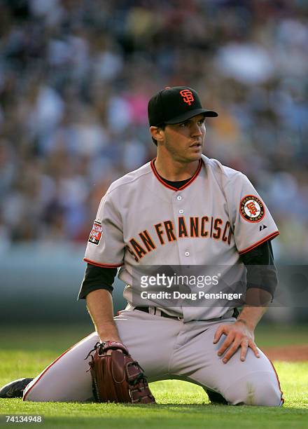 Starting pitcher Barry Zito of the San Francisco Giants reacts after fielding a bunt by Troy Tulowitzki of the Colorado Rockies in the first inning...