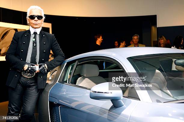 Designer Karl Lagerfeld poses with an Audi R8 at Kaleidoscopic Vision of a Car: Audi R8 by Karl Lagerfeld on May 12, 2007 in New York City.
