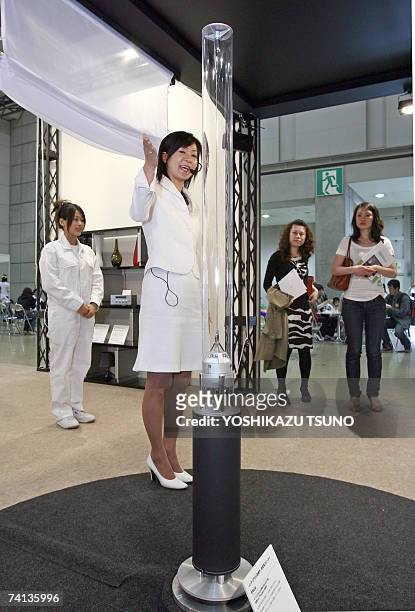 Japan's electronics giant Sony employees introduce the prototype model of transparent pole speaker system "Rin", which renders stereo sound towards...