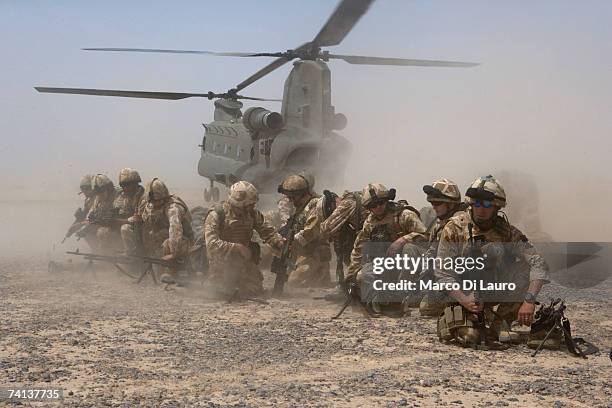 British Soldiers from the 5th Regiment of the Royal Artillery are deployed from Chinook helicopters at the Dwyir Forward Operation Base , May 13,...