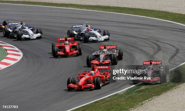 Fernando Alonso of Spain and McLaren Mercedes runs out of the track at the first corner at the start of the Spanish Formula One Grand Prix at the...