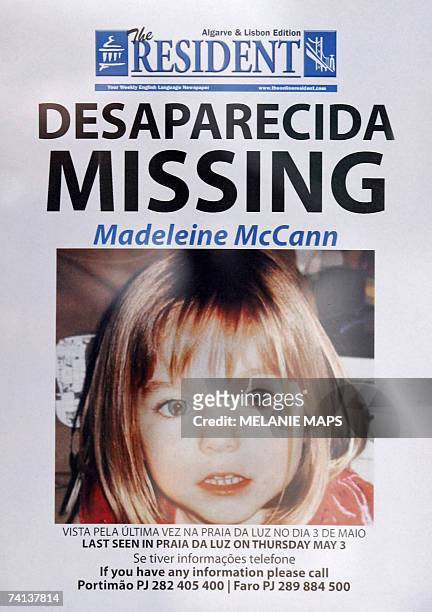 Picture taken 13 May 2007 shows a poster displaying the police and infos desk numbers for the missing four-year-old British girl Madeleine McCann in...