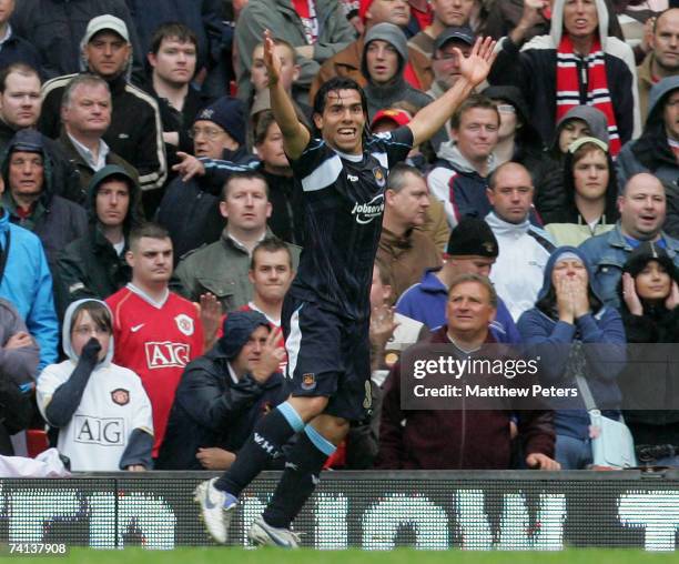 Carlos Tevez of West Ham United celebrates scoring their first goal during the Barclays Premiership match between Manchester United and West Ham at...