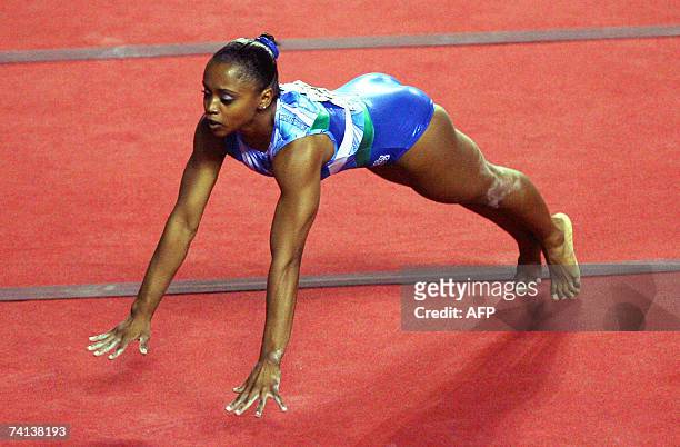 Daiane Dos Santos of Brazil performs in the womens final of the floor excercise at the Gymnastics World Cup in Gent 13 May 2007. AFP PHOTO/ BELGA /...
