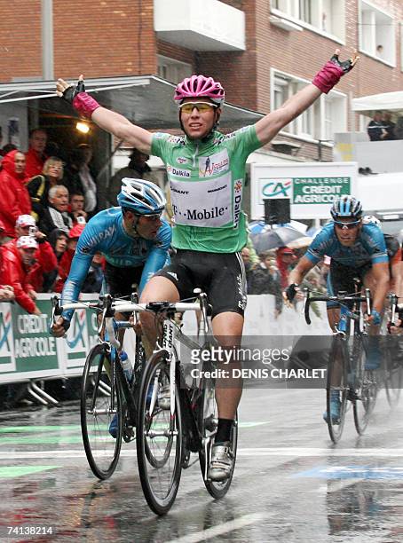 British Mark Cavendish raises his arms, 13 May 2007 in Dunkirk, as he crosses the finish line and wins the last stage of the Four Days to Dunkirk...