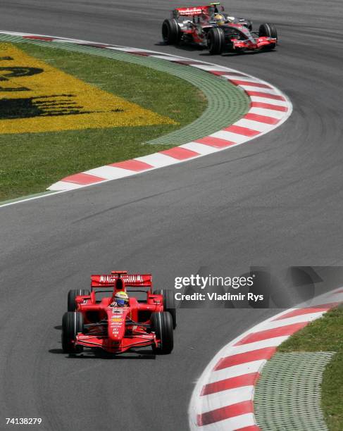 Felipe Massa of Brazil and Ferrari in action followed by Lewis Hamilton of Great Britain and McLaren Mercedes during the Spanish Formula One Grand...