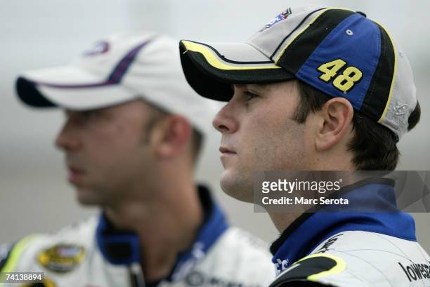 Jimmie Johnson , driver of the Lowe's Chevrolet, and crew chief Chad Knaus, seen on pit road prior to the NASCAR Nextel Cup Series Dodge Avenger 500...