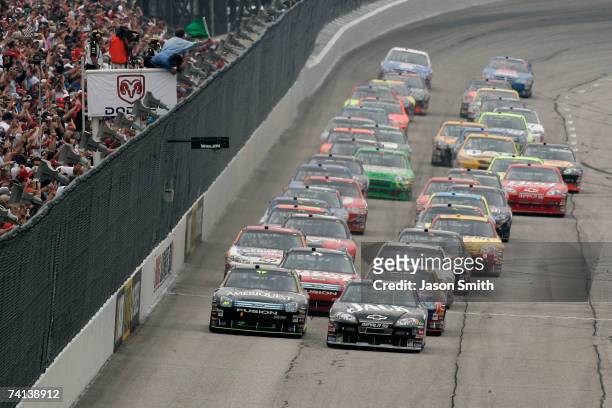 Clint Bowyer, driver of the Jack Daniel's Chevrolet, leads Greg Biffle, driver of the Ameriquest Ford, and the rest of field to the green flag to...