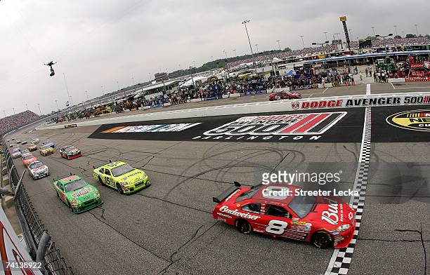 Dale Earnhardt Jr., driver of the Budweiser Chevrolet, crosses the start/finish line during the NASCAR Nextel Cup Series Dodge Avenger 500 on May 13,...