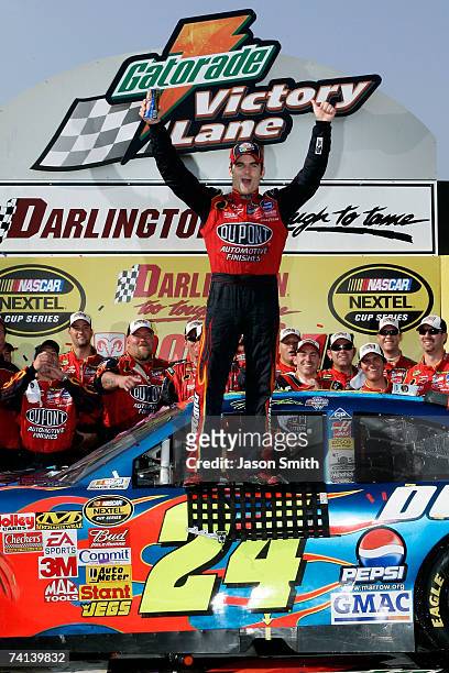 Jeff Gordon, driver of the DuPont Chevrolet, celebrates in victory lane after winning NASCAR Nextel Cup Series Dodge Avenger 500 on May 13, 2007 at...