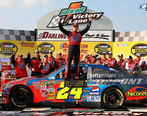 Jeff Gordon, driver of the DuPont Chevrolet, celebrates in victory lane after winning NASCAR Nextel Cup Series Dodge Avenger 500 on May 13, 2007 at...