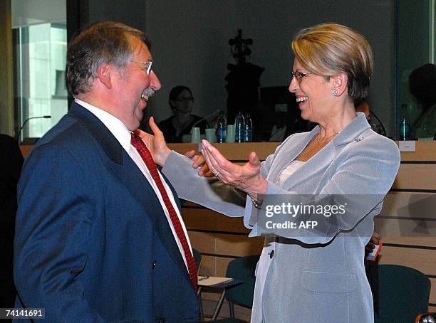 French Defense Minister Michele Alliot-Marie greets her Belgian counterpart Andre Flahaut 14 May 2007 before the start a Defense Council meeting at...