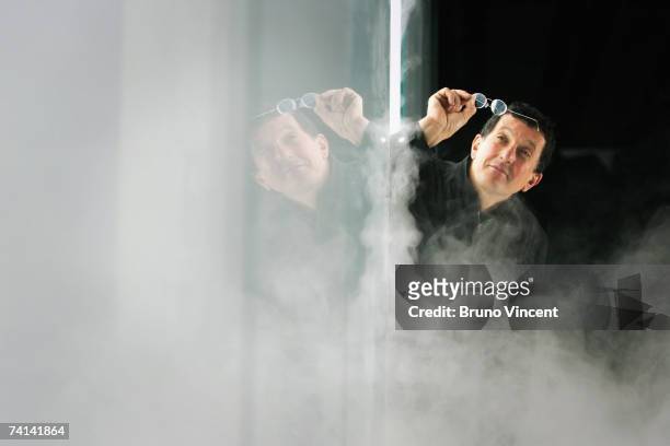 Anthony Gormley poses for photographers within his 'Blind Light' installation at the Hayward Gallery on May 14, 2007 in London. Oscillating...